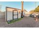 Large backyard with storage shed and desert landscaping at 410 N 56Th Pl, Mesa, AZ 85205