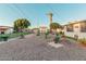 Spacious backyard with gravel, shed, and potted plants at 410 N 56Th Pl, Mesa, AZ 85205