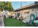 Landscaped backyard with patio furniture and orange tree at 410 N 56Th Pl, Mesa, AZ 85205