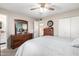 Spacious bedroom with ceiling fan and large dresser at 410 N 56Th Pl, Mesa, AZ 85205