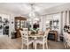 Bright dining area with round table and modern chandelier at 410 N 56Th Pl, Mesa, AZ 85205