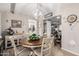 Elegant dining room featuring a round table and view to kitchen at 410 N 56Th Pl, Mesa, AZ 85205