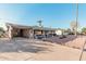 House exterior with solar panels and spacious driveway at 410 N 56Th Pl, Mesa, AZ 85205