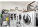 Laundry room with washer, dryer, and storage cabinet at 410 N 56Th Pl, Mesa, AZ 85205