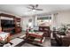 Spacious living room featuring leather furniture and fireplace at 410 N 56Th Pl, Mesa, AZ 85205