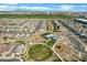 Aerial view of a well-planned community with lush green spaces, walking paths, and a playground at 4342 E Sagebrush St, Gilbert, AZ 85296