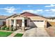 Low angle shot of a single-story home with a well-kept lawn and a two-car garage at 4342 E Sagebrush St, Gilbert, AZ 85296