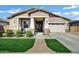 Charming single-story home featuring a well-manicured lawn and a two-car garage at 4342 E Sagebrush St, Gilbert, AZ 85296