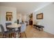 Bright dining area featuring a round table, comfortable seating, and decorative wall hangings at 4354 N 82Nd St # 137, Scottsdale, AZ 85251