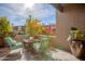 Private patio area with comfortable seating and views of the well-maintained landscape at 4354 N 82Nd St # 137, Scottsdale, AZ 85251