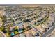 Aerial view of a community with neatly lined houses, streets, and pools at 476 E Atlantic Dr, Casa Grande, AZ 85122