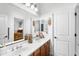 Bright bathroom features double sinks, wood cabinets, and decorative accents at 476 E Atlantic Dr, Casa Grande, AZ 85122