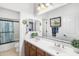 Neutral bath offering dual sinks, wood cabinets, large mirror and a tub/shower combo at 476 E Atlantic Dr, Casa Grande, AZ 85122