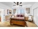 Bedroom with a ceiling fan, wall art, and two chairs at 476 E Atlantic Dr, Casa Grande, AZ 85122