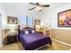 Bedroom showcases a purple bedspread, two side tables, decorative lamps, and an attached bath at 476 E Atlantic Dr, Casa Grande, AZ 85122