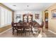 Formal dining room featuring a crystal chandelier, hardwood floors, and ample seating for eight at 476 E Atlantic Dr, Casa Grande, AZ 85122