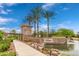 Community entrance showcasing stone signage, landscaping, and water feature at 476 E Atlantic Dr, Casa Grande, AZ 85122