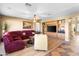 Comfortable living room featuring built-in shelving and a plush sectional couch with a ceiling fan at 476 E Atlantic Dr, Casa Grande, AZ 85122