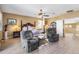 Spacious main bedroom featuring a seating area, ceiling fan, and views of the backyard, creating a relaxing retreat at 476 E Atlantic Dr, Casa Grande, AZ 85122