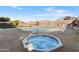 A backyard pool with a built-in hot tub offers a relaxing outdoor space at 476 E Atlantic Dr, Casa Grande, AZ 85122