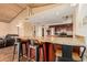 Kitchen island with bar stool seating and stone countertops provides plenty of space for food preparation at 50031 N 27Th Ave, New River, AZ 85087