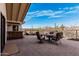 Outdoor patio with stone flooring, built in bar and seating area with mountain views at 50031 N 27Th Ave, New River, AZ 85087