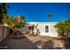 Backyard with gravel, two orange trees, and a patio at 5807 E Leonora St, Mesa, AZ 85215