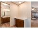 Partial view of bathroom with double vanity and wood cabinets at 5807 E Leonora St, Mesa, AZ 85215