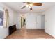 Bedroom with wood floors, large closet, and ceiling fan at 5807 E Leonora St, Mesa, AZ 85215