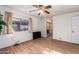 Bedroom with wood floors, large closet, and ceiling fan at 5807 E Leonora St, Mesa, AZ 85215