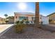 Single-wide manufactured home with carport and palm trees at 5807 E Leonora St, Mesa, AZ 85215