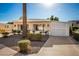 Tan manufactured home with white lattice-covered carport at 5807 E Leonora St, Mesa, AZ 85215