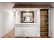 Built-in home bar with wood shelving and mirror at 5807 E Leonora St, Mesa, AZ 85215