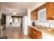 Kitchen with wood cabinets, double sink, and modern appliances at 5807 E Leonora St, Mesa, AZ 85215