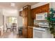 View of kitchen with ample cabinetry and adjacent dining area at 5807 E Leonora St, Mesa, AZ 85215