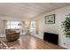 Living room with hardwood floors and recliner at 5807 E Leonora St, Mesa, AZ 85215