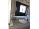 Bathroom features a vanity with a large mirror and updated fixtures at 6039 N 73Rd Ave, Glendale, AZ 85303