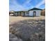 Ranch style home with green roof and gravel landscaping at 6039 N 73Rd Ave, Glendale, AZ 85303