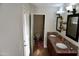 Double sink bathroom featuring modern lighting, a walk-in shower and granite countertops at 6845 E Beverly Ln, Scottsdale, AZ 85254