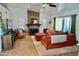 Comfortable living room featuring a stone fireplace and wood-look floors at 6845 E Beverly Ln, Scottsdale, AZ 85254