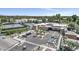 Birds eye view of the clubhouse, parking and tennis courts surrounded by lush landscaping and palm trees at 7705 E Doubletree Ranch Rd # 56, Scottsdale, AZ 85258