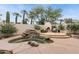 Gorgeous backyard with a rock waterfall feature, in-ground spa, and outdoor fireplace at 7705 E Doubletree Ranch Rd # 56, Scottsdale, AZ 85258