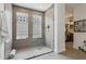 Contemporary bathroom boasts a glass enclosed shower and unique glass block windows for natural light at 7705 E Doubletree Ranch Rd # 56, Scottsdale, AZ 85258