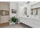 Bright bathroom featuring dual sinks, sleek cabinets, and a plant for added vibrancy at 7705 E Doubletree Ranch Rd # 56, Scottsdale, AZ 85258