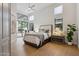 Bright bedroom with high ceilings, clerestory windows and a glass door leading to a private patio at 7705 E Doubletree Ranch Rd # 56, Scottsdale, AZ 85258