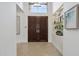 Bright foyer featuring a double door entry, high ceilings and display shelving with natural light at 7705 E Doubletree Ranch Rd # 56, Scottsdale, AZ 85258