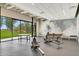 Spacious gym with rowing machines and ample natural light overlooking green lawns and mature trees at 7705 E Doubletree Ranch Rd # 56, Scottsdale, AZ 85258