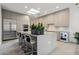 Modern kitchen featuring sleek cabinets, stainless steel appliances, an island with seating and skylight at 7705 E Doubletree Ranch Rd # 56, Scottsdale, AZ 85258