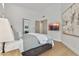 Cozy main bedroom showcasing hardwood floors, neutral decor, and a wall-mounted TV at 7705 E Doubletree Ranch Rd # 56, Scottsdale, AZ 85258