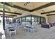 An outdoor patio featuring tables and chairs, set beneath a wooden canopy at 7705 E Doubletree Ranch Rd # 56, Scottsdale, AZ 85258